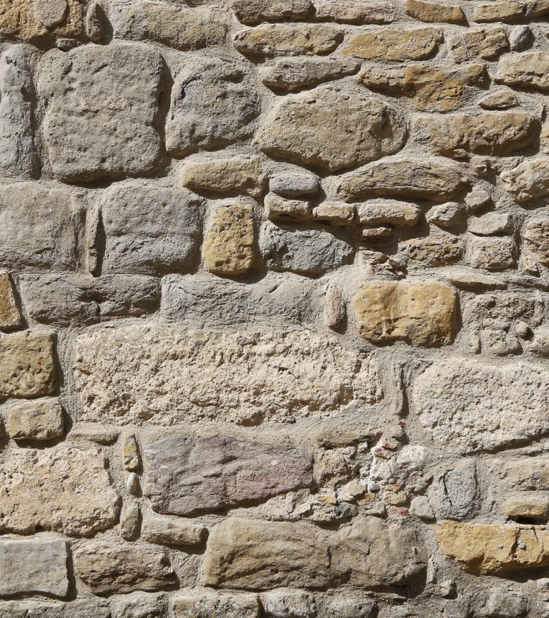 Ancient stone wall texture, close-up architectural background, Carcassonne, France